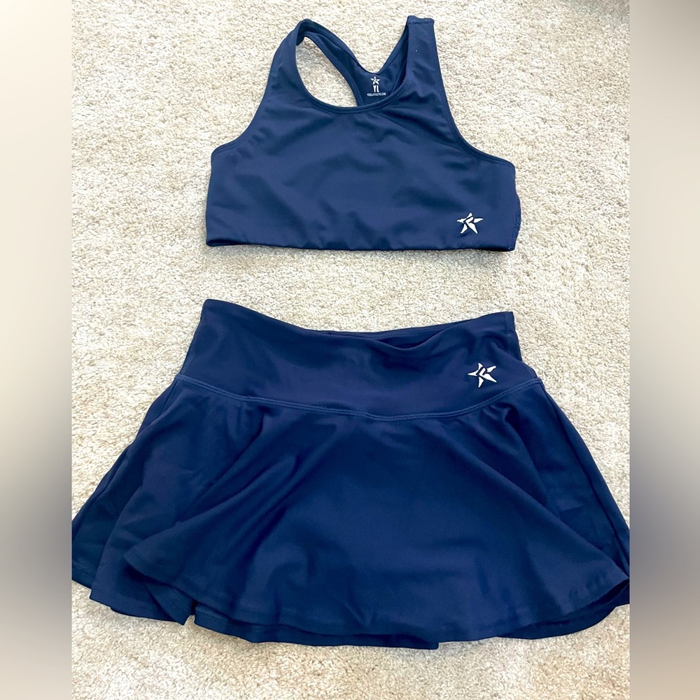 YL Rebel Athletics sports bra and flouncy skirt